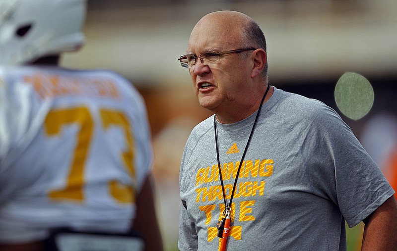 Tennessee offensive coordinator Mike DeBord is shown with offensive lineman Jashon Robertson in spring practice. The current bowl preparation is another extended time for developing players.