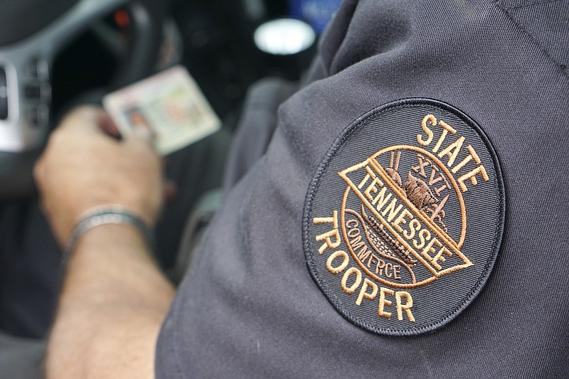 Tennessee State Highway Patrol Trooper Wade Clepper enters an ID and works up a report after making a surprise safety inspection at the Monteagle weigh station on I-24 East on October 1, 2015. Staff Photo by Dan Henry / The Chattanooga Times Free Press.