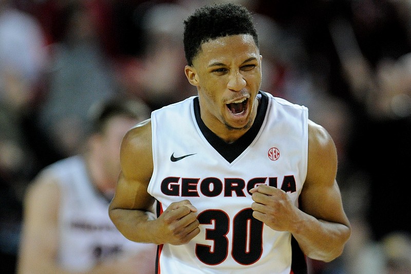 Georgia guard J.J. Frazier (30) celebrates after forcing a Georgia Tech foul during the second half of an NCAA college basketball game on Saturday, Dec. 19, 2015, in Athens, Ga. Georgia won 75-61. J.J. Frazier scored 35 points in the game. (AJ Reynolds/Athens Banner-Herald via AP) MAGS OUT; MANDATORY CREDIT