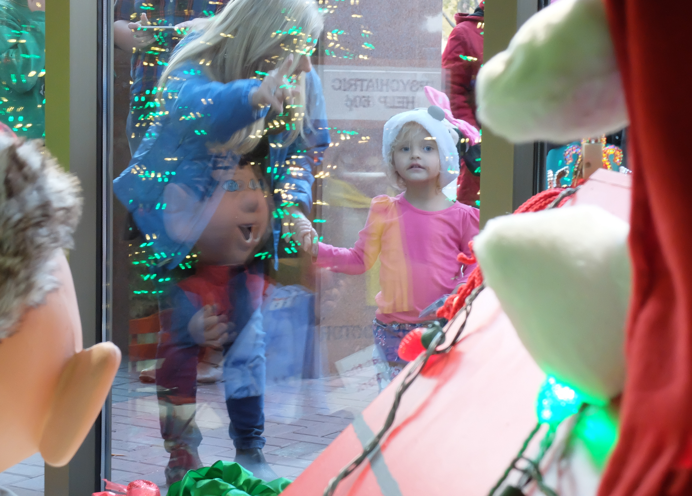 Caroline Webb, 3, gets her first look through the EPB holiday windows.