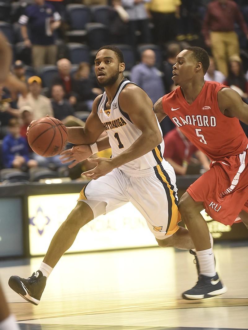 UTC's Greg Pryor drives past Radford's Rashun Davis during Tuesday's game at McKenzie Arena. The Mocs won 77-75 to improve to 10-2.