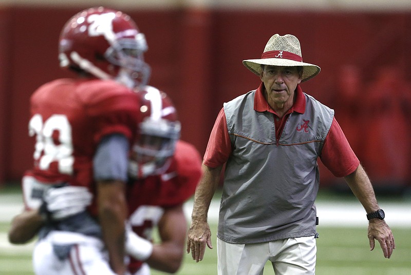 Nick Saban watches Alabama players go through a Cotton Bowl practice earlier this week. The veteran Crimson Tide coach told ESPN he can't see himself leaving Tuscaloosa for another job.