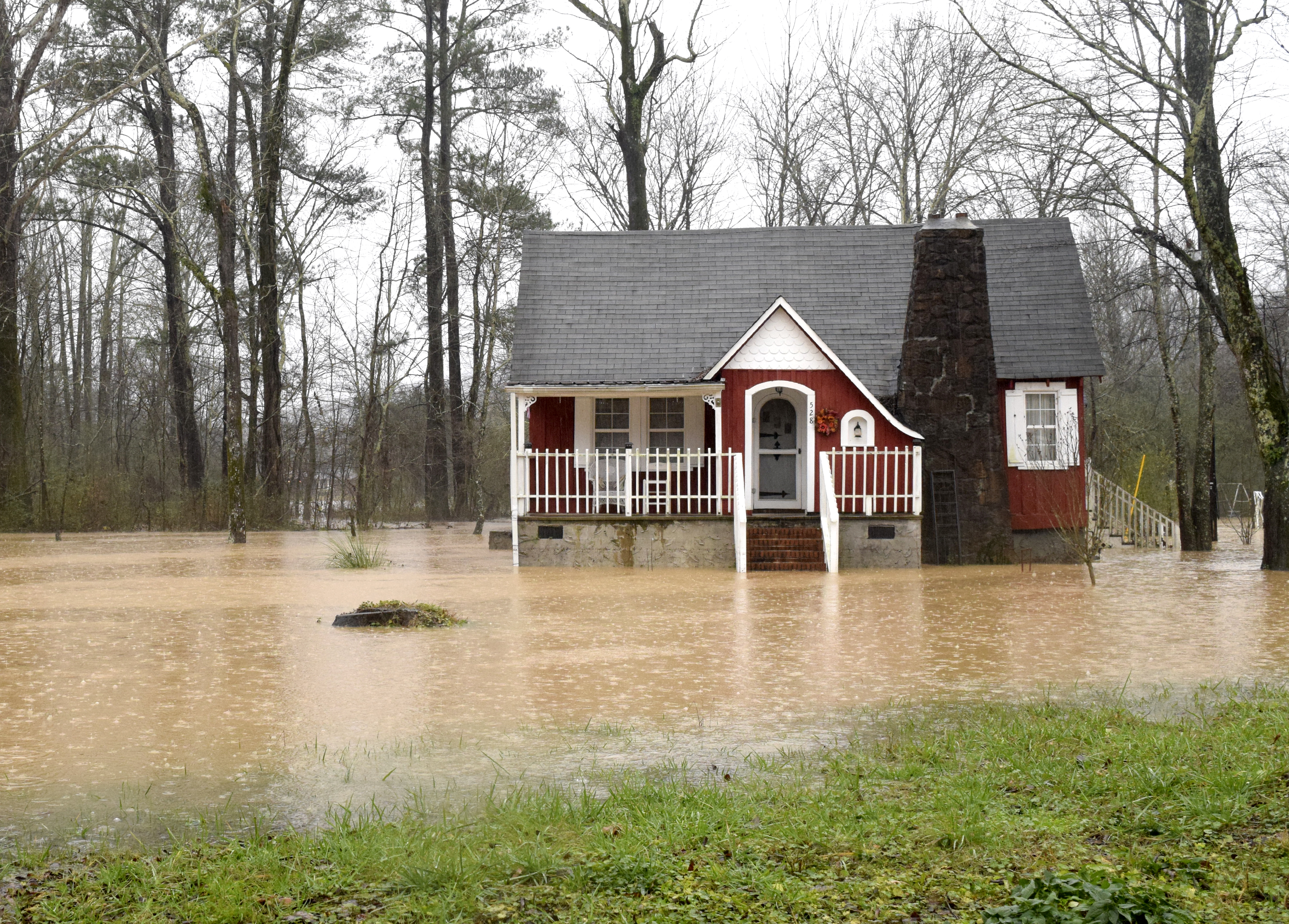 A home on Jackson Road in the Falling Community is surrounded by the flood waters of Falling Water Creek. Heavy rains caused flooding and road closures across Hamilton County on Christmas Day.