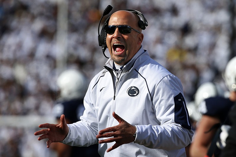 Penn State head coach James Franklin disagrees with an official during the second half of an NCAA college football game against Michigan in State College, Pa., Saturday, Nov. 21, 2015. Michigan won 28-16. (AP Photo/Gene J. Puskar)