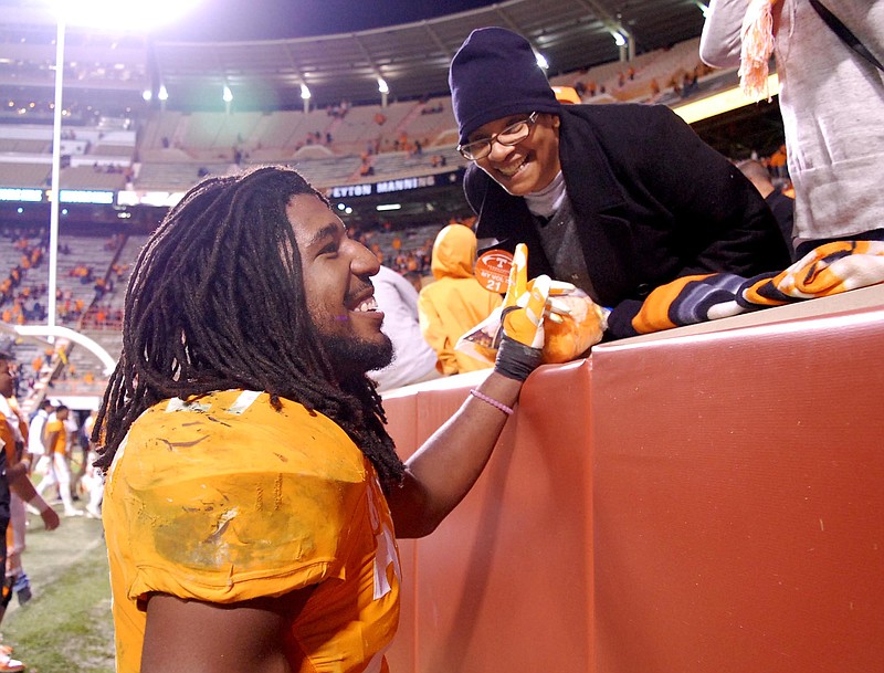 Tennessee's Jalen Reeves-Maybin (21) greets fans as he leaves the field.  Reeves-Maybin recovered a fumble to seal Tennessee's 27-24 victory.  The South Carolina Gamecocks visited the Tennessee Volunteers in SEC football action November 7, 2015.