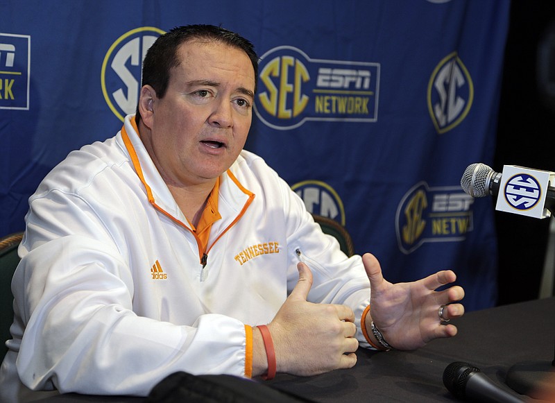 Tennessee head coach Donnie Tyndall answers a question during a news conference at the Southeastern Conference NCAA men's college basketball media day in Charlotte, N.C., Wednesday, Oct. 22, 2014. (AP Photo/Chuck Burton)