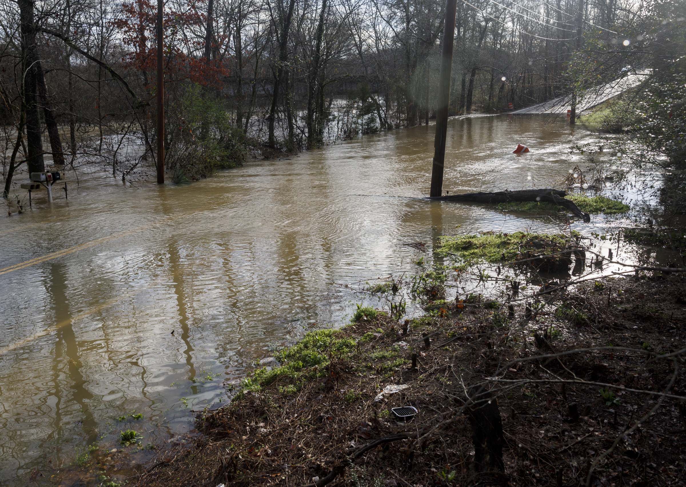Boy Scout Road, where three stranded motorists were rescued Friday night, is still made impassable by floodwater the following day after heavy rains brought flooding to the region Saturday, Dec. 26, 2015, in Hixson, Tenn. Rain is expected to continue into the next week.
