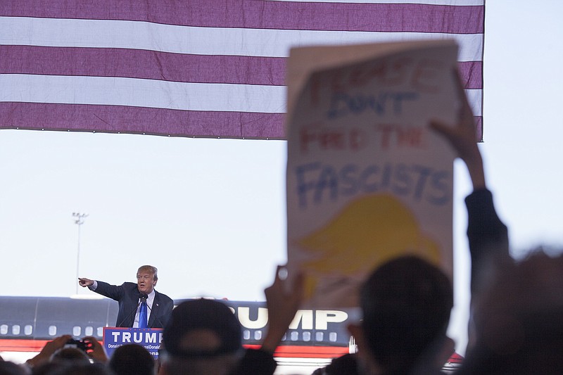 Donald Trump, a Republican presidential hopeful, speaks at a campaign rally at the International Air Response hangar in Mesa, Ariz., Dec. 16, 2015. (Caitlin O'Hara/The New York Times)