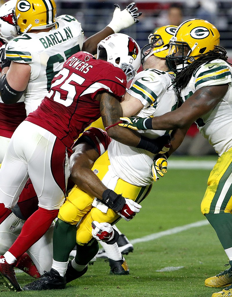 Cardinals sack Aaron Rodgers 8 times, rout Packers 38-8