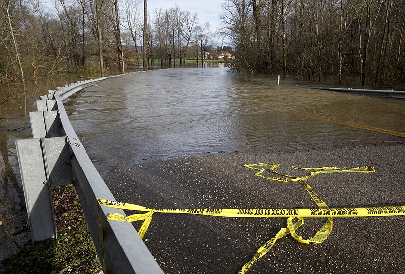 Old Hixson Pike was made impassible by floodwater after heavy rains Saturday.