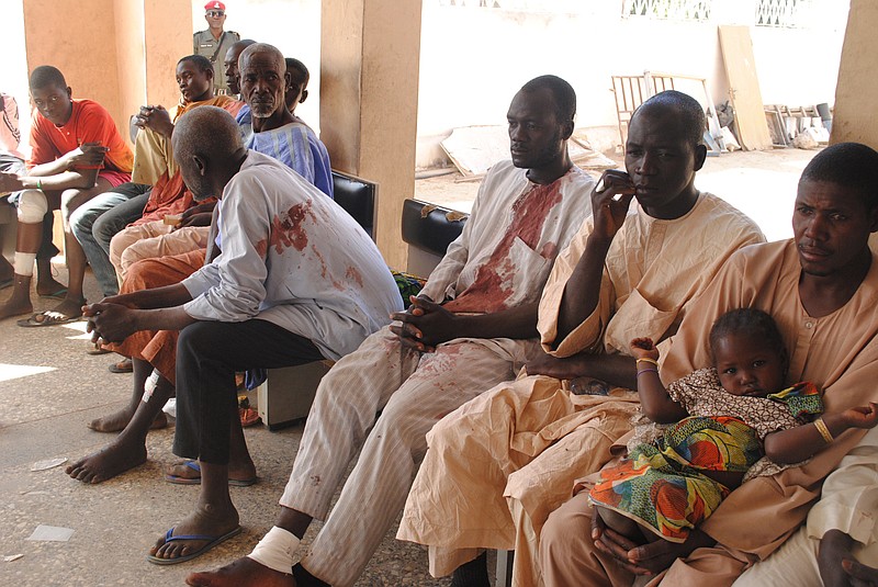 
              Victims of a Boko Haram attack wait for  treatment at a hospital in Maiduguri, Nigeria Monday, Dec. 28, 2015. Boko Haram Islamic extremists struck the northeastern Nigerian city of Maiduguri for the first time in months Monday with rocket-propelled grenades and multiple suicide bombers, witnesses said. At least 50 people were killed and the death toll could go higher. (AP Photo/Jossy Ola)
            