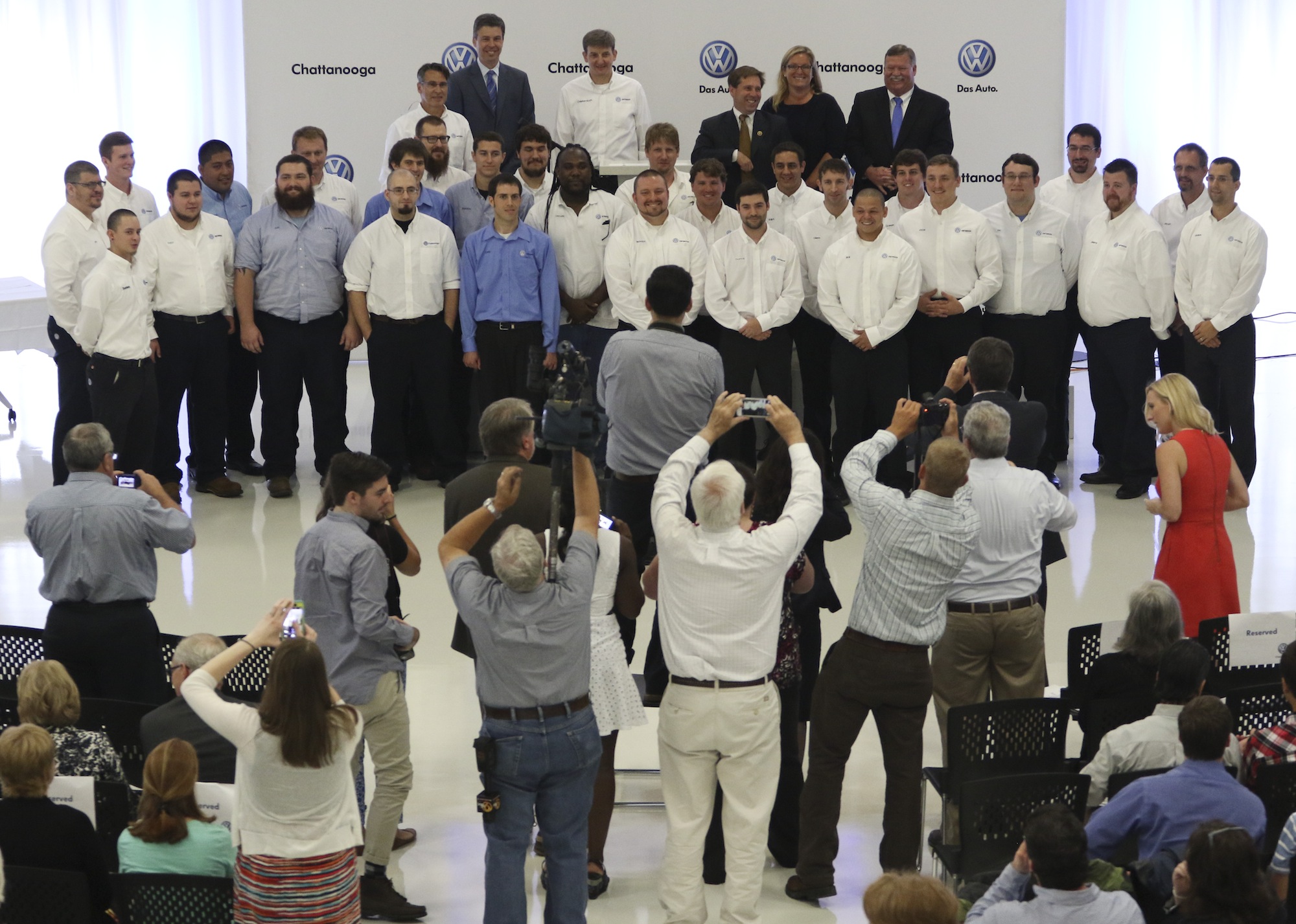 New graduates of Volkswagen Chattanooga's Automation Mechatronics Program and Car Mechatronics Programs have their photos taken at the conclusion of their graduation ceremony on August 6, 2015. Twenty-five students graduated completing a three-year educational program.