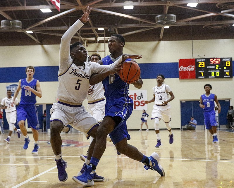 McCallie's JaVaughn Craig, right, presses into Central's Terron Hayes during their Times Free Press Best of Preps basketball tournament championship game at Chattanooga State Technical Community College on Tuesday, Dec. 29, 2015, in Chattanooga, Tenn.