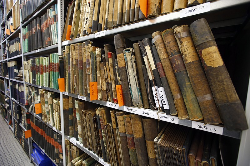 
              Files and books are stored in the temperature-controlled storage room where historic archived documents are stored on shelves of the Paris Police Prefecture Archives department, in Paris, France, Tuesday, Dec. 29, 2015. France is opening police and legal archives from the collaborationist Vichy regime, allowing free access to previously classified documents from World War II. (AP Photo/Francois Mori)
            