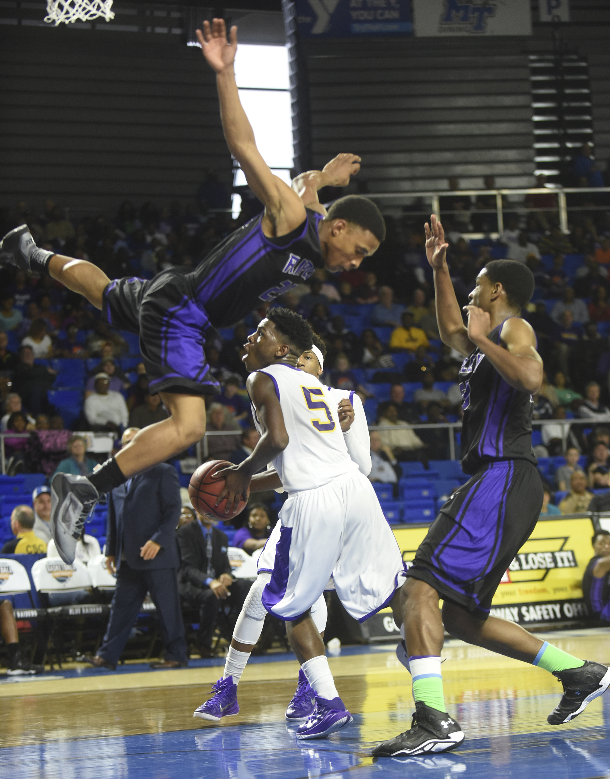 Central High's Terron Hayes heads toward the goal as Ripley's Steven Collins, left, goes airborne and Isaiah Crawley guards in the quarter final game at Middle Tennessee State University on March 11.