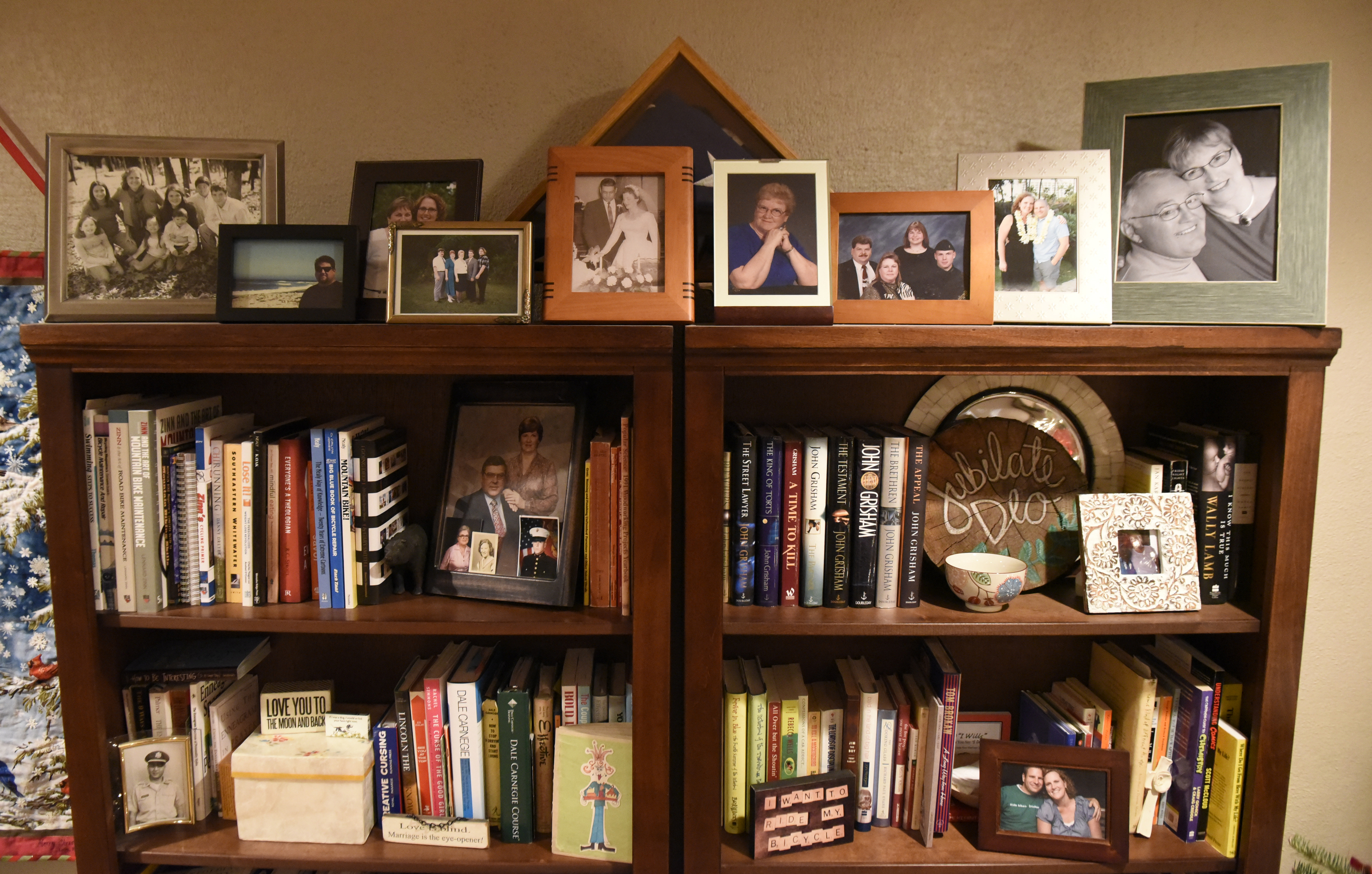 In combining their book collections, Jennifer and Carl Sheffield both got rid of many books, keeping two of Carl's three bookcases. Photographed at their home on Wednesday, Dec. 23, 2015, in Chattanooga, Tenn., the bookshelves are not as cram-packed as they were when Carl used them, and books are mixed with decorative pieces.