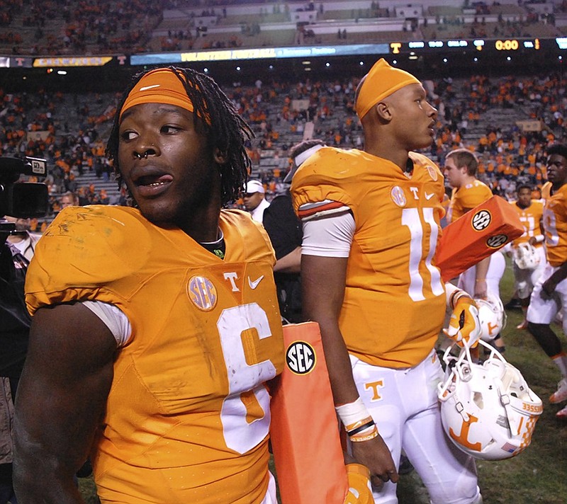 Tennessee running back Alvin Kamara, left, and quarterback Joshua Dobbs will take on Northwestern in the Outback Bowl today. As participants in the only college football game in the country being played from noon to 1 p.m. on New Year's Day, the Volunteers will have a chance to show the program's progress if they perform well early.