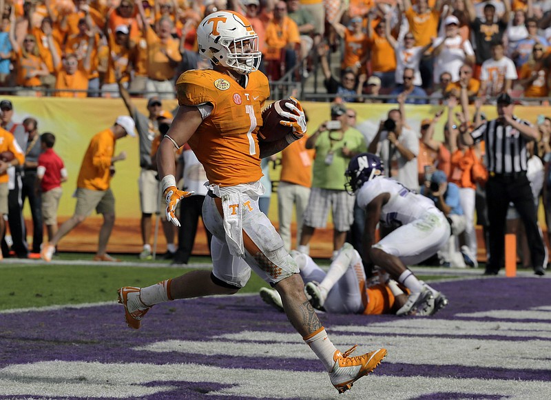 Tennessee running back Jalen Hurd runs three yards for a touchdown against Northwestern during the third quarter of the Outback Bowl NCAA college football game Friday, Jan. 1, 2016, in Tampa, Fla. (AP Photo/Chris O'Meara)