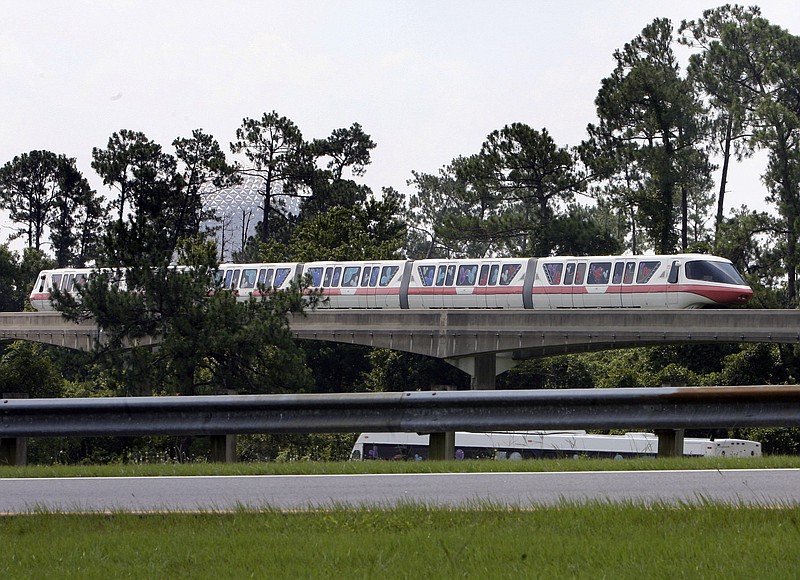 A monorail train sits motionless on a track outside EPCOT Sunday, July 5, 2009, at Walt Disney World in Orlando, Fla., after the park's monorail transit system was shut down after two monorail trains crashed early Sunday morning in the Magic Kingdom section of the park, killing one train's operator, emergency officials said.