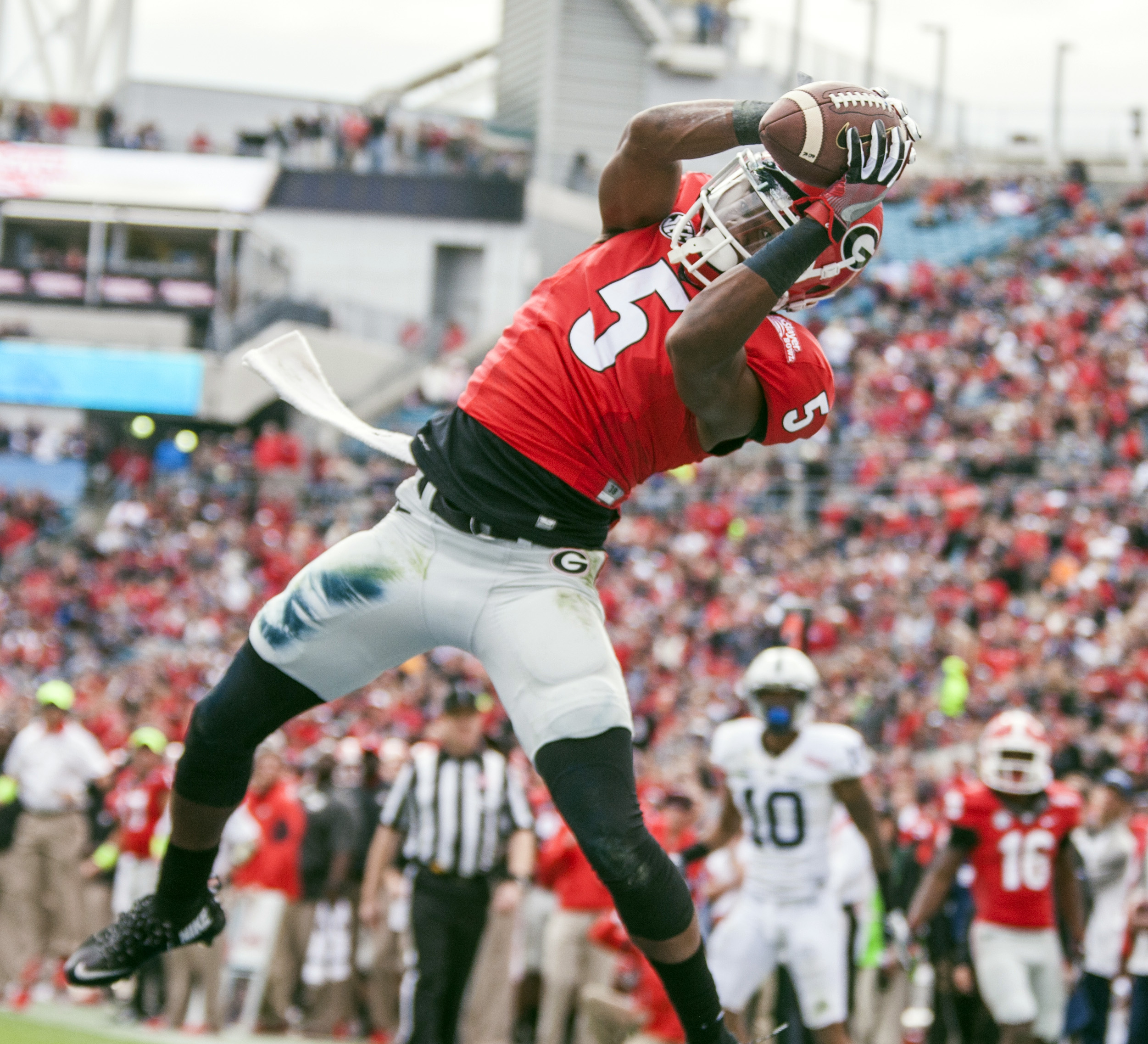 George wide receiver Terry Godwin catches a pass in the end zone for touchdown during the first half of the TaxSlayer Bowl NCAA college football game against Penn State in Jacksonville, Fla., Saturday, Jan. 2, 2016. (AP Photo/Mark Wallheiser)