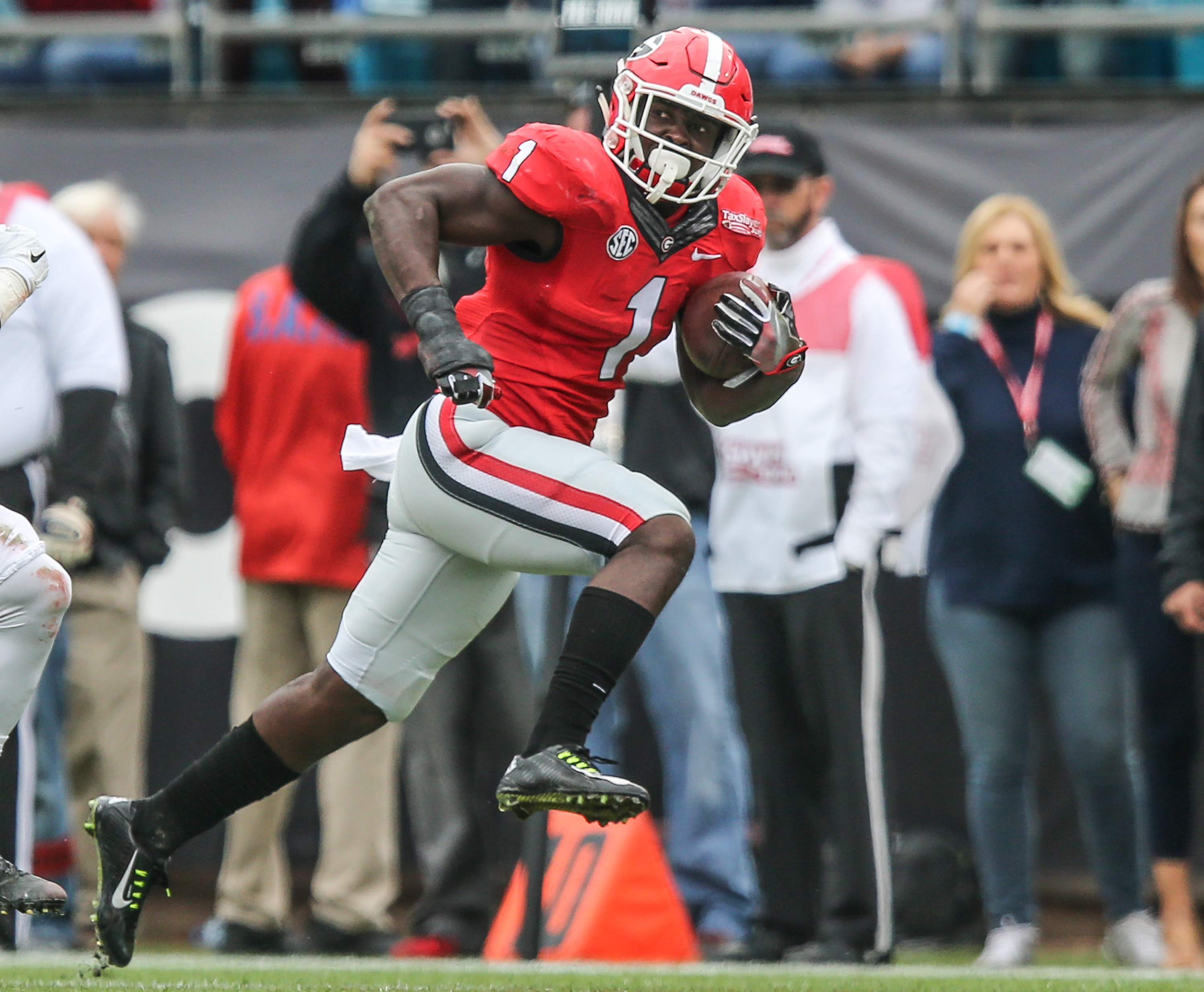 Georgia Bulldogs running back Sony Michel (1) rushes the ball for 28 yards against Penn State during the first half of the TaxSlayer Bowl NCAA college football game, Saturday, Jan. 2, 2016, in Jacksonville, Florida. Georgia won 24-17. (Gary Lloyd McCullough/The Florida Times-Union via AP) MANDATORY CREDIT
