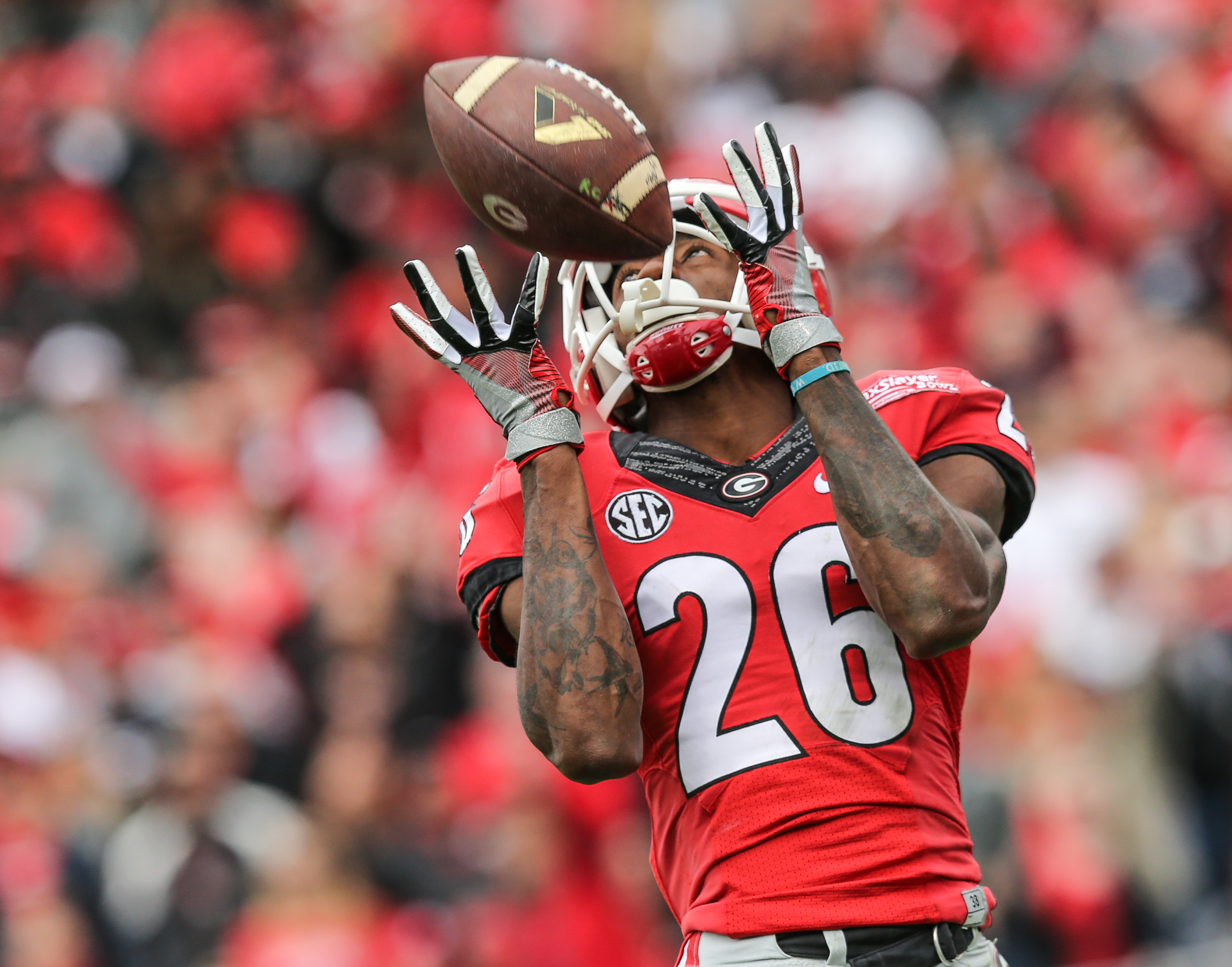 Georgia wide receiver Malcolm Mitchell (26) catches a pass for a touchdown against Penn State during the second half of the TaxSlayer Bowl NCAA college football game, Saturday, Jan. 2, 2016, in Jacksonville, Florida. Georgia won 24-17. (Gary Lloyd McCullough/The Florida Times-Union via AP) MANDATORY CREDIT
