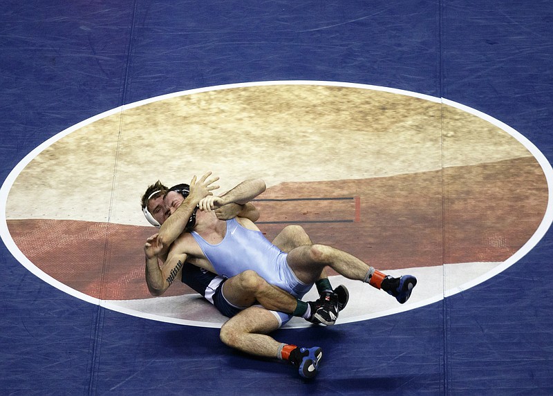 Penn. State's Zain Retherford, left, wrestles North Carolina's Evan Henderson during their Southern Scuffle college wrestling tournament 149 lb championship bout at McKenzie Arena on Saturday, Jan. 2, 2016, in Chattanooga, Tenn.