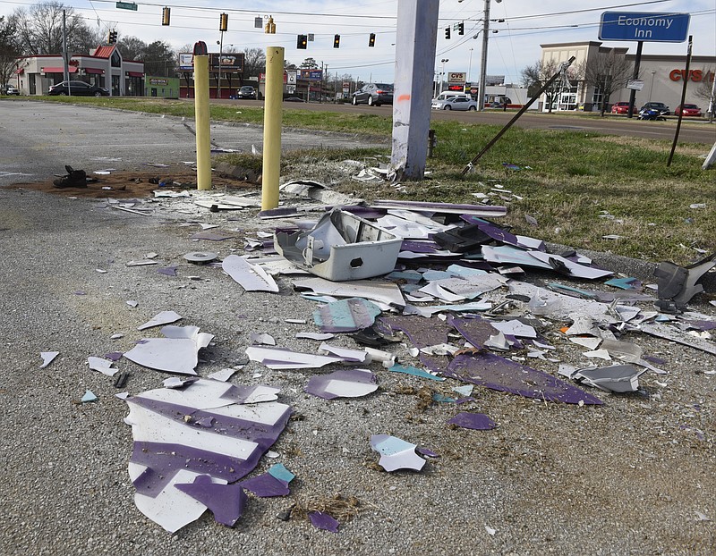 A broken sign is evidence of a single-car accident that killed two people about 4:30 a.m. Sunday morning at 5606 Brainerd Road.