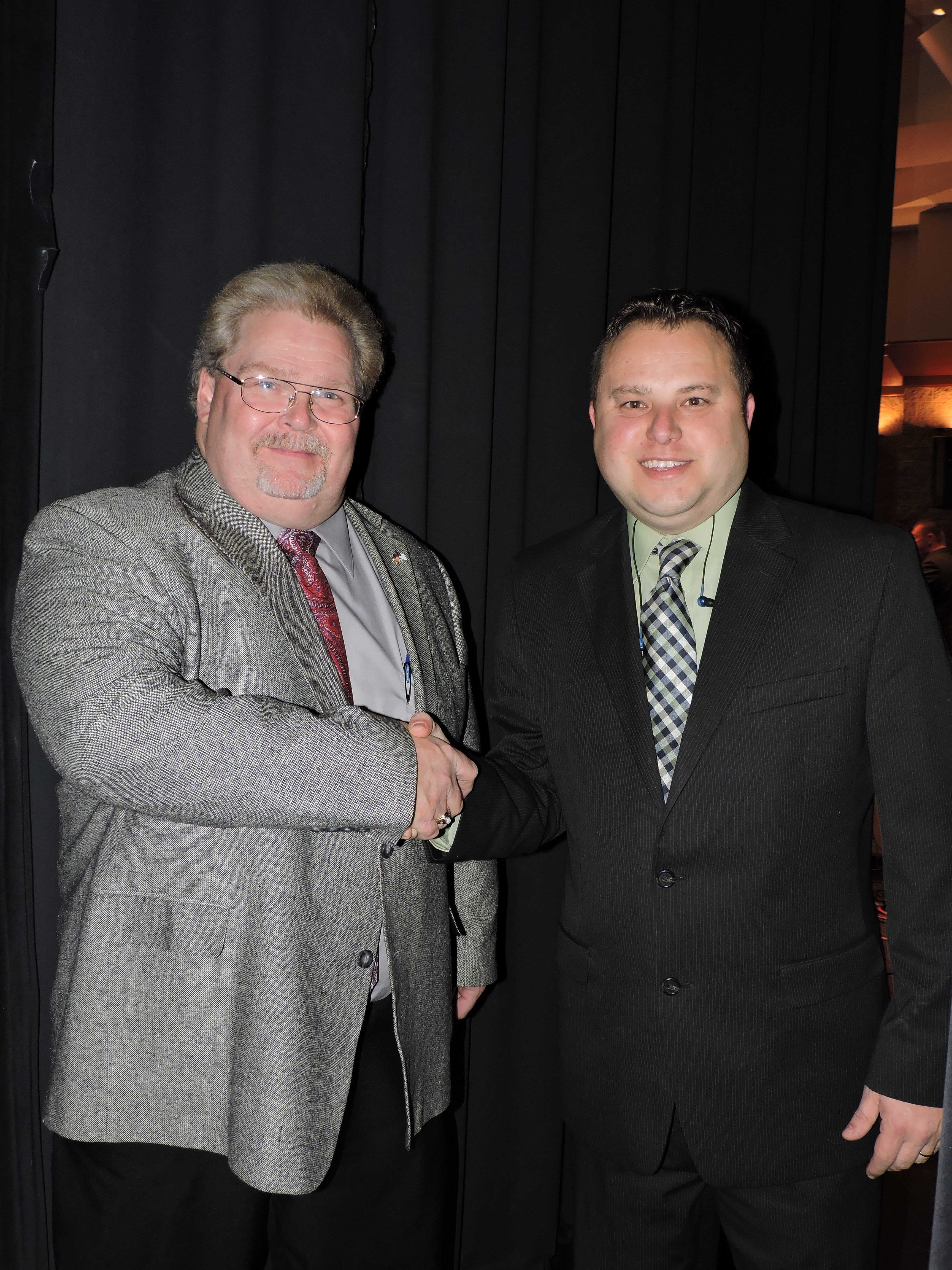 WBFC DJ Dana Russell, left, introduces the Appointed Quartet, welcoming tenor singer Stephen Roberts to the stage. WBFC is one of the annual sponsors of the event.