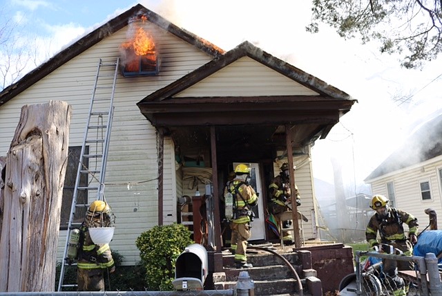 Firefighters battle a house fire Monday, Jan. 4, 2016, at 1706 South Orchard Knob Ave.