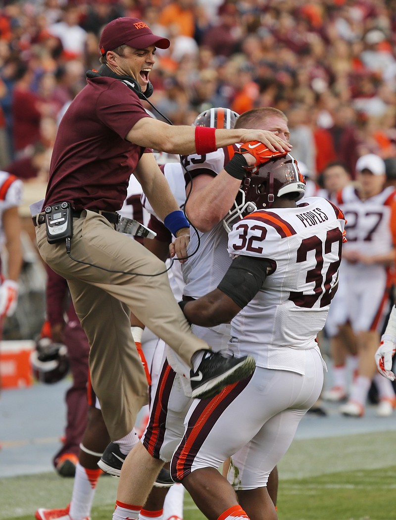 Virginia Tech assistant coach Shane Beamer, shown celebrating in late November during a win over Virginia, was named Tuesday to Georgia's staff.