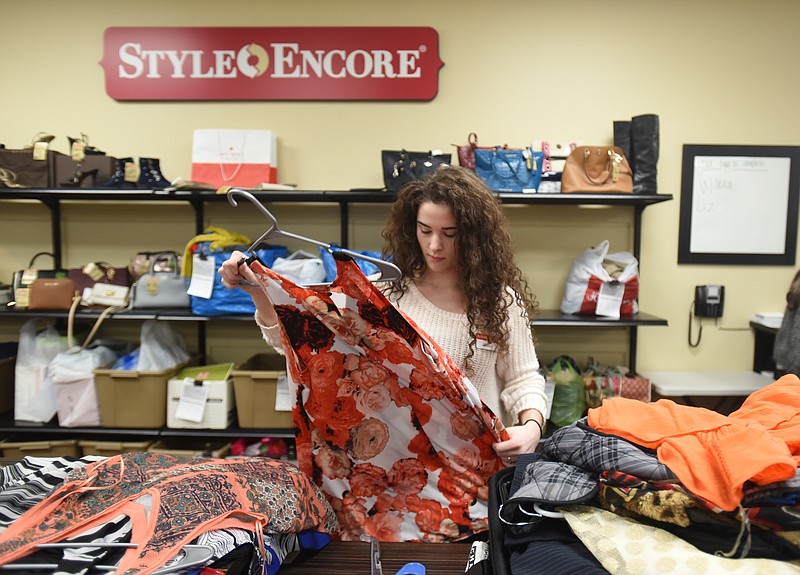 Ashley Woodward works Tuesday, January 5, 2016 at Style Encore near Hamilton Place.