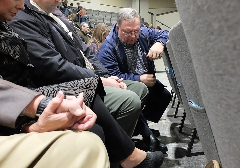 Dr. Steve Highlander is first to pray in one of many breakout groups made up of four to six people each Tuesday night inside the worship center at Christway Church in Ooltewah.