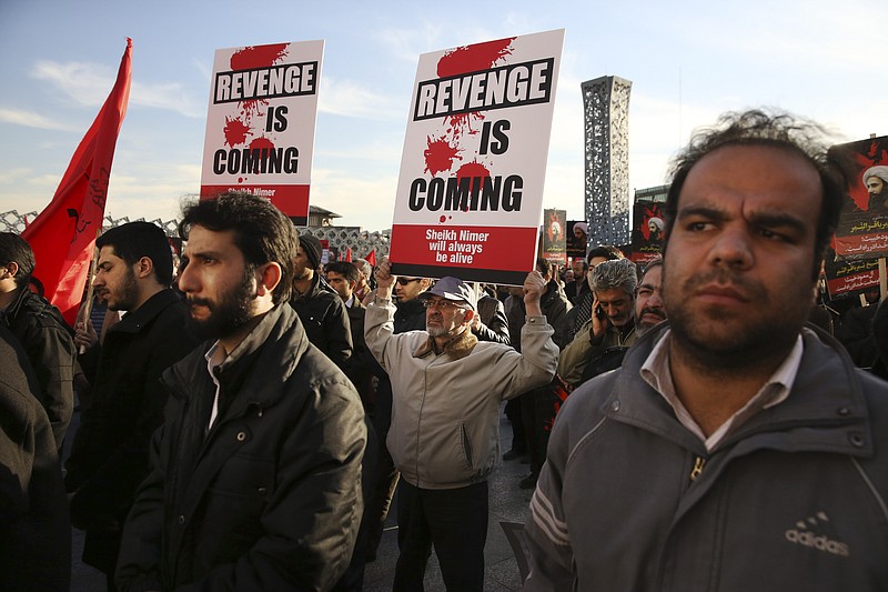 Iranian demonstrators hold anti-Saudi placards in a rally to protest the execution by Saudi Arabia last week of Sheikh Nimr al-Nimr, a prominent opposition Saudi Shiite cleric, in Tehran, Iran, Monday, Jan. 4, 2016. 