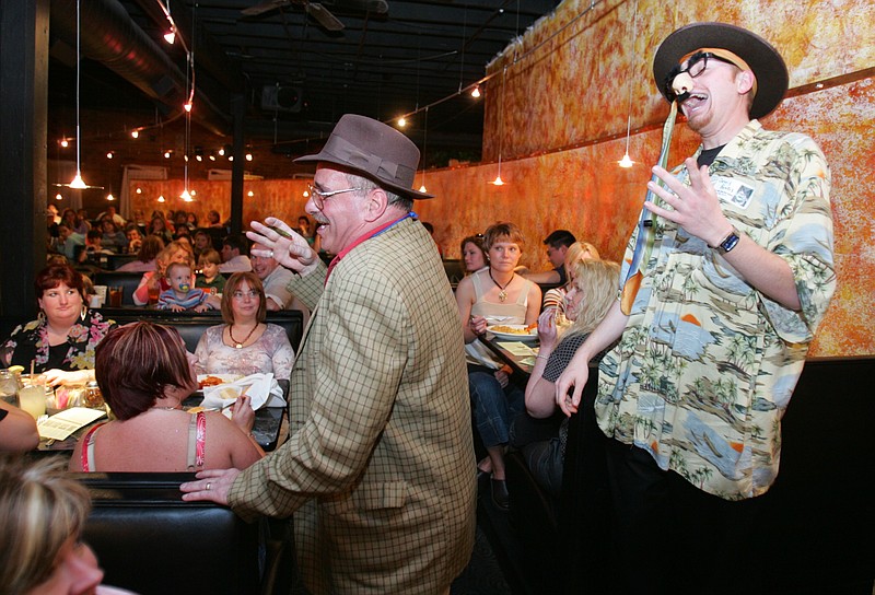 Vaudeville Cafe actors Steve Hampton, left, as the coach, and J.C. Smith, as the class clown, perform in front of audience members during a show. The cafe closed late last year and will now be occupied by The Venue on Market
