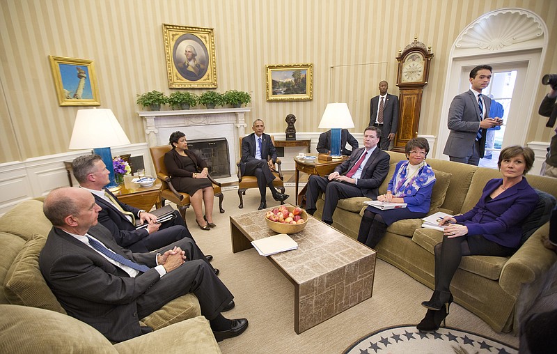 President Barack Obama meets with top law enforcement officials in the Oval Office of the White House in Washington, Monday, Jan. 4, 2016, to discuss executive actions the president can take to curb gun violence. 