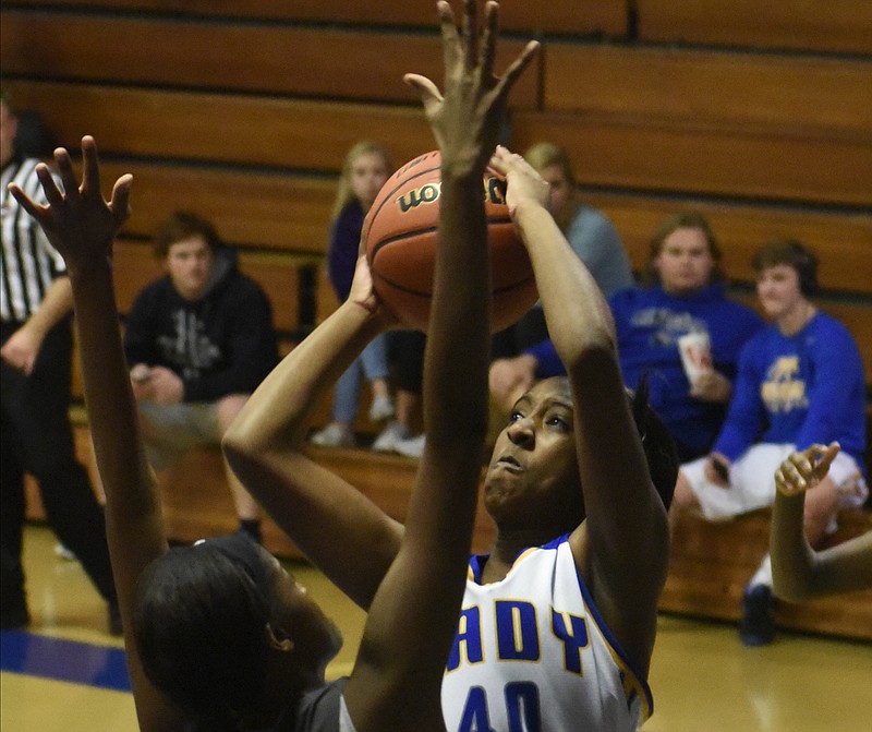 Marisa McCalla shoots over the defense of Tyner's Shnecka Taylor as Boyd-Buchanan hosts Tyner in a girls basketball game on Thursday, Jan. 7, 2016, in Chattanooga, Tenn.