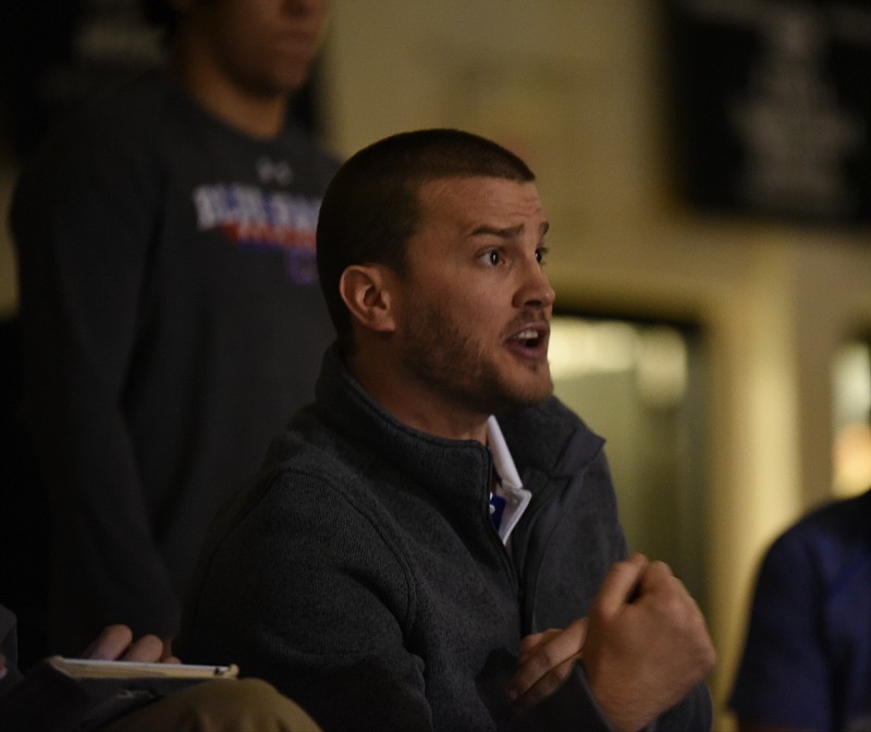 Cleveland coach Jake Yost reacts to the action on the mat at Bradley Central Thursday night.