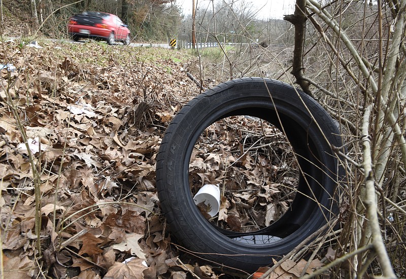 Tires are seen that have been dumped along Lee Avenue near Burnt Mill Road on Thursday, Jan. 7, 2016, in Chattanooga, Tenn.