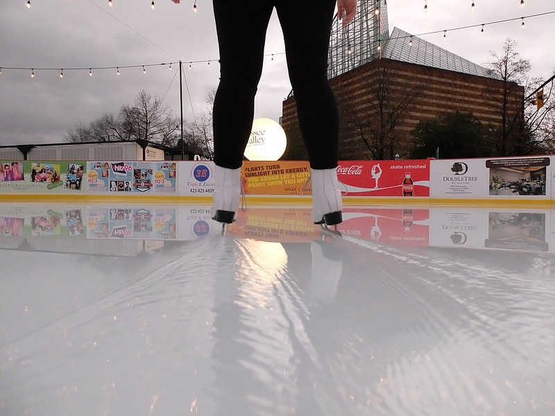 Melanie Baykal leaves a wake of water behind as she skates recently at Ice on the Landing. Baykal was first on the ice after while waiting for her flight departure to see family for Christmas in south Florida. "We haven't had to close for warm weather," Barry Cole said. "We closed for the rain, earlier. We shut down at 2 p.m., but reopened at 5:30 p.m.," he said. "We're doing really great, because the outdoor rink in Atlanta has shut down this week because of the warm weather. They're further south, a little warmer than here. But, they are outdoors and covered. That traps the heat in an they are having trouble staying frozen.