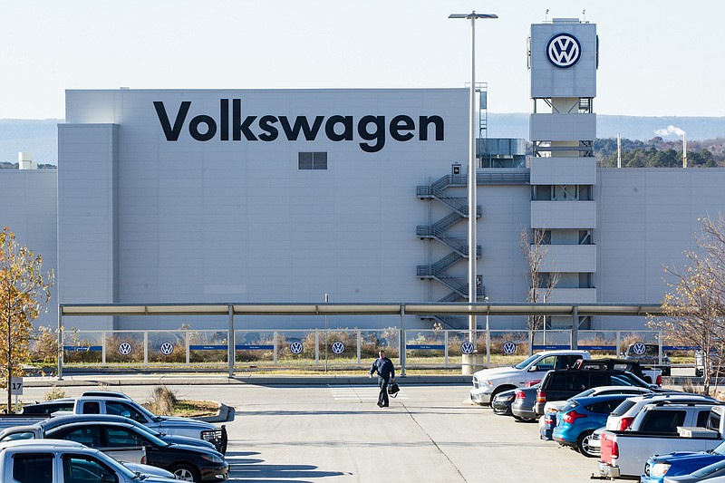 A man walks through the employee parking lot at the Volkswagen plant in Chattanooga, where some of the diesel-powered Passats were produced that regulators say violated air emission standards.