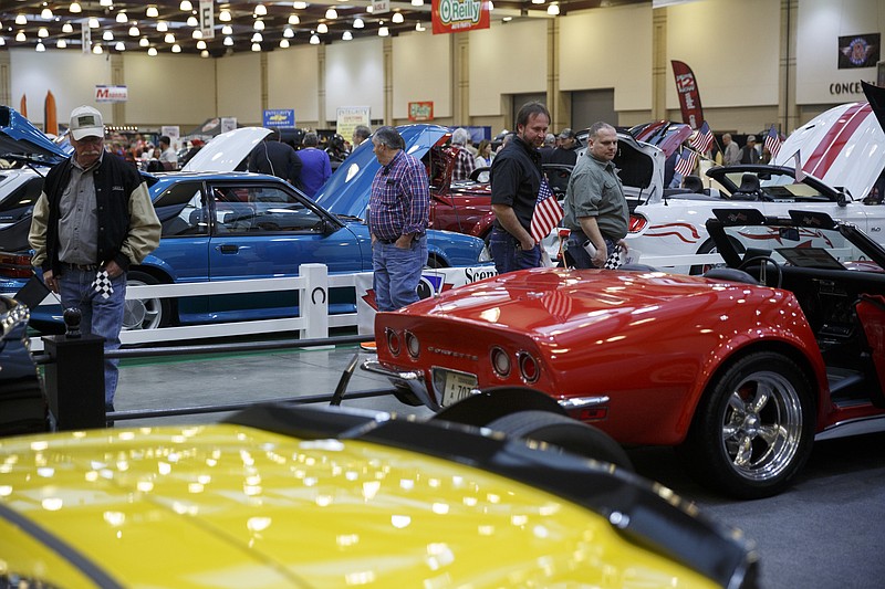 People walk past classic cars on display during the World of Wheels auto show at the Chattanooga Convention Center on Saturday, Jan. 9, 2016, in Chattanooga, Tenn. The show features new and classic cars along with vendors and entertainment.