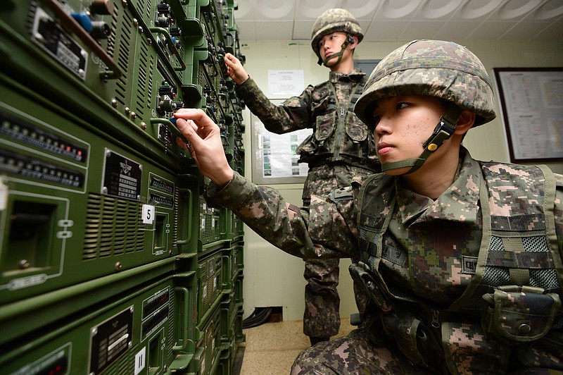 
              South Korean army soldiers adjust equipment used for propaganda broadcasts near the border area between South Korea and North Korea in Yeoncheon, South Korea, Friday, Jan. 8, 2016. South Korea responded to North Korea's nuclear test with broadcasts of anti-Pyongyang propaganda across the rival's tense border Friday, believed to be the birthday of North Korean leader Kim Jong Un. (Lim Tae-hoon/Newsis via AP) KOREA OUT
            