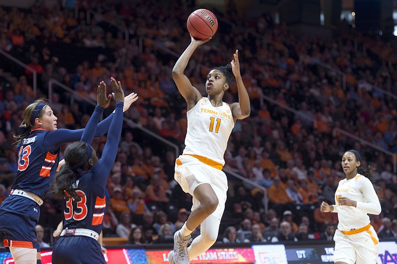 Tennessee's Diamond DeShields makes a short jump shot over Auburn defenders Katie Frerking, left, and Janiah McKay during an NCAA college basketball game in Knoxville, Tenn., on Sunday, Jan.10, 2016. Tennessee defeated Auburn 79-52. (Saul Young/Knoxville News Sentinel via AP)