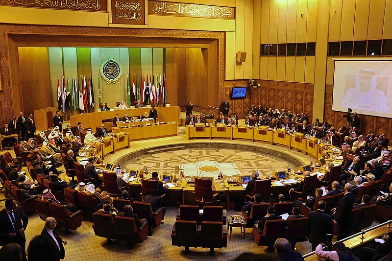 
              Arab foreign ministers attend an emergency Arab League session in Cairo, Egypt, Sunday, Jan. 10, 2016. At the meeting Arab foreign ministers called on Arab states to take a clear position against Iran's alleged meddling in Arab affairs. Emirati Foreign Minister Sheikh Abdullah bin Zayed Al Nahyan and Saudi Arabia's Foreign Minister Adel al-Jubeir accused Iran at an emergency Arab League session of intentionally failing to protect Saudi diplomatic posts. (AP Photo Ahmed Omar)
            