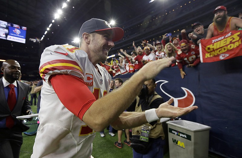 
              Kansas City Chiefs quarterback Alex Smith (11) runs off the field following an NFL wild-card playoff football game against the Houston Texans, Saturday, Jan. 9, 2016, in Houston. Kansas City won 30-0. (AP Photo/Tony Gutierrez)
            