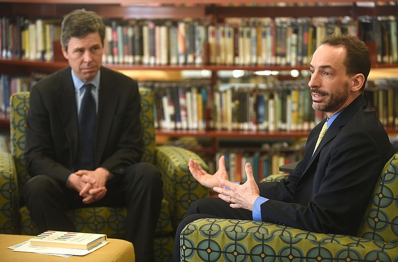 Author Paul Tough, right, speaks about his book as Mayor Andy Berke listens Monday in the Baylor School library.