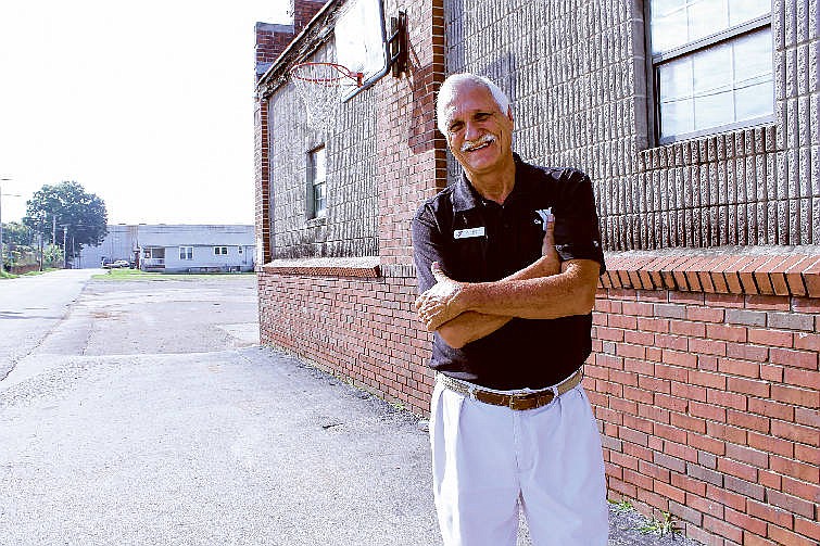 Joe Smith, founder of YCAP, stands outside the boxing club at 1600 Central Ave. that the YMCA plans to fix up once the building is declared surplus city property and the YMCA receives ownership of it.