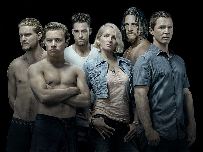 
              This image released by TNT shows the cast of the new series "Animal Kingdom," starring Ellen Barkin, from row center, as the matriarch of a crime family. Kevin Reilly has begun the process of transforming the Turner Networks of TBS and TNT from a home for television comfort food into what he hopes is a destination for buzzy, edgy fare that can compete on the same turf as the AMC, Netflix and HBOs of the world. (Michael Muller/TNT via AP)
            