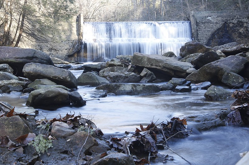 Water falls over the dam at Rainbow Lake in Signal Mountain, Tenn. The Land Trust for Tennessee is helping the town of Signal Mountain to permanently protect the 342-acre public park space.